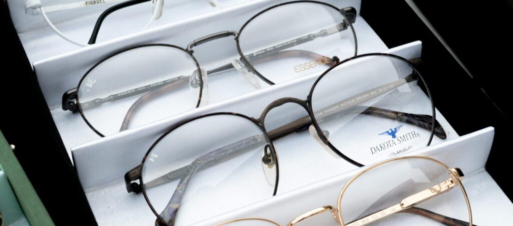 Close-up of assorted eyeglasses showcased in an orderly fashion for selection.